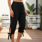 👖🌿 Relaxed capri pants with an elastic waistband, side ties, and pockets