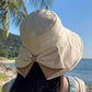 👒 💐 Women's Bowknot Wide Brim Sun Protective Hat – Oversized wide brim blocks UV rays, delicate bow decor, lightweight breathable fabric, ideal for beach, travel & outdoor walking✨